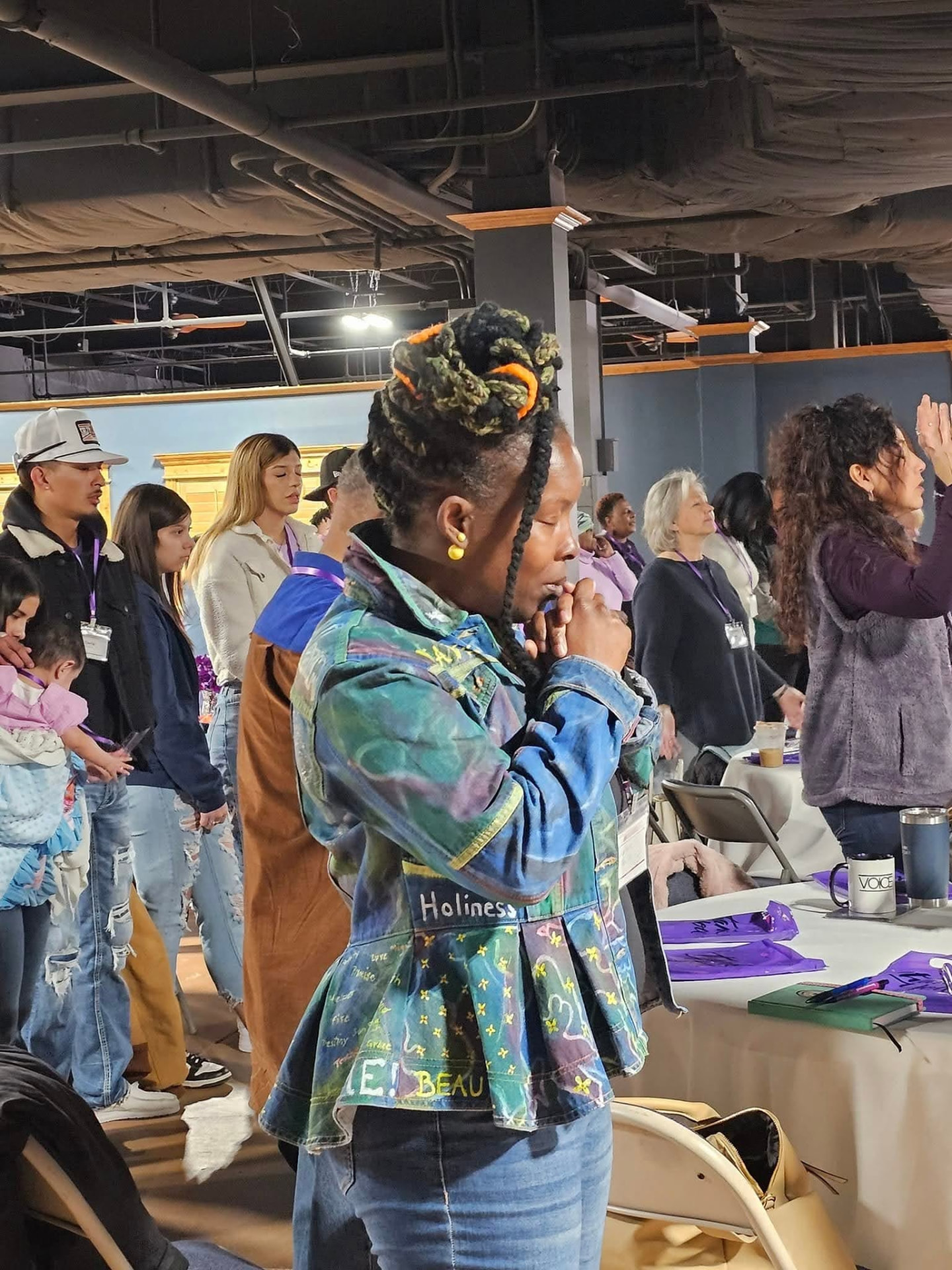 A woman in prayer during a Sistership gathering