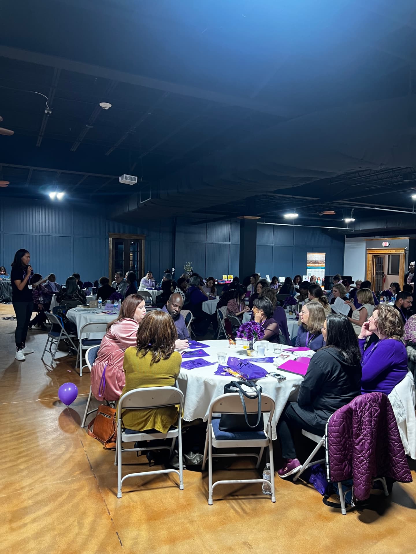 The full room gathered at a Sistership event