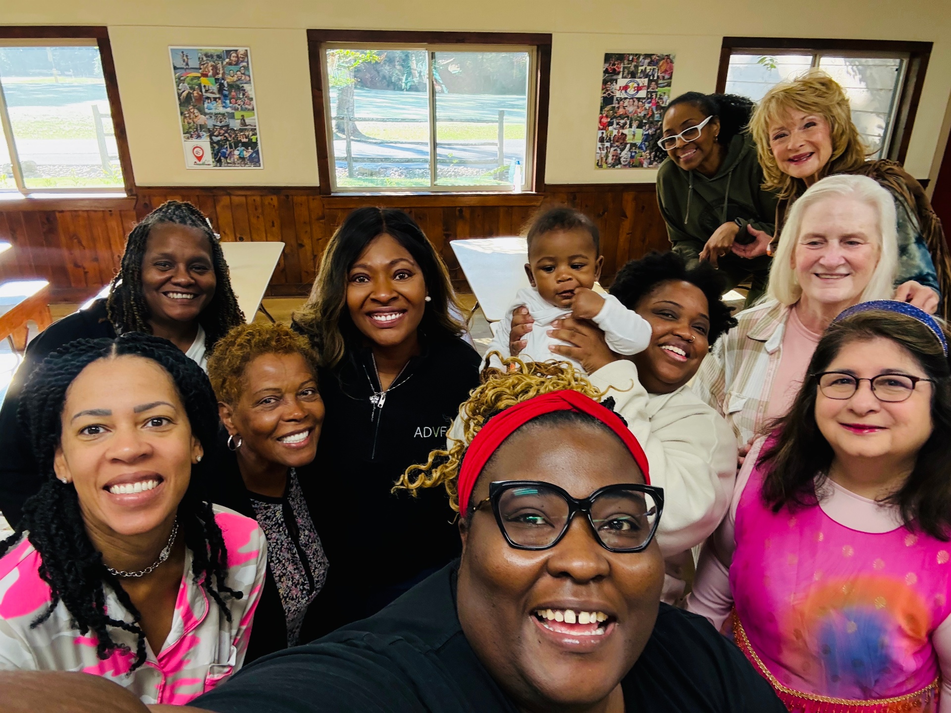 Women of the Sistership gathered for a joyful group selfie